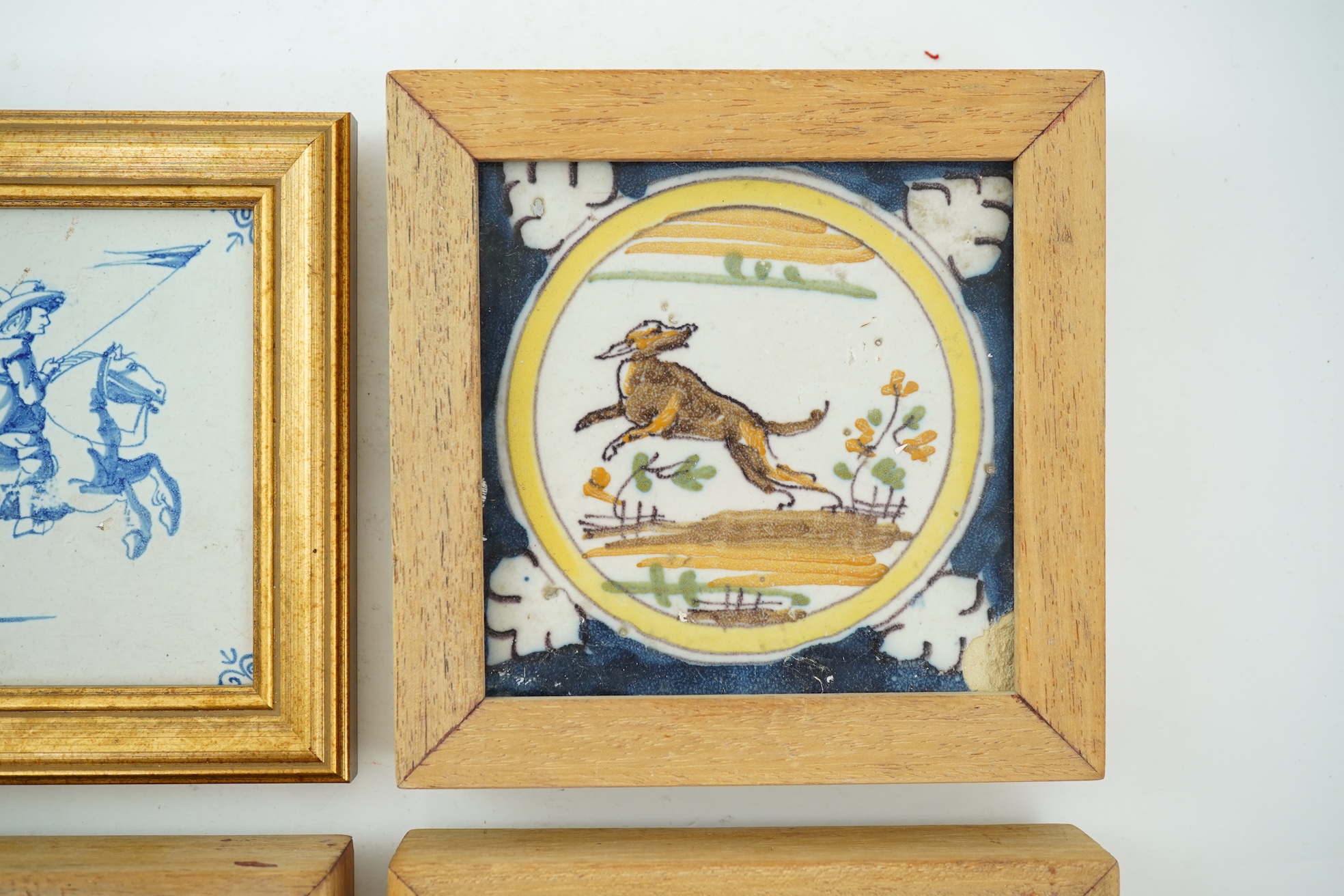 Three Spanish polychrome maiolica ‘animal’ tiles, Triana, early 18th century and a Delft blue and white tile, 19th century
